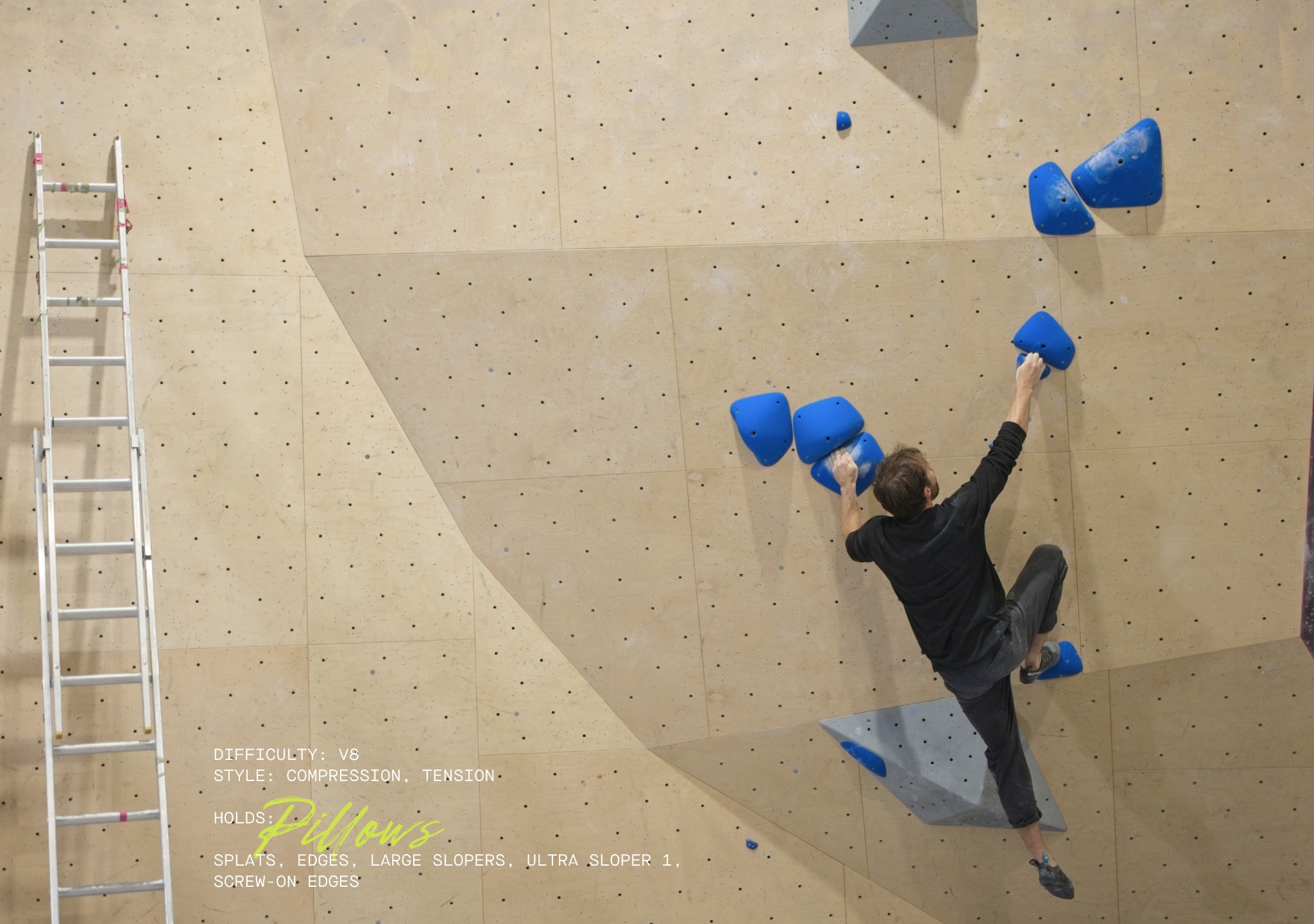 Climber on a V8 compression and tension climb using Pillows holds